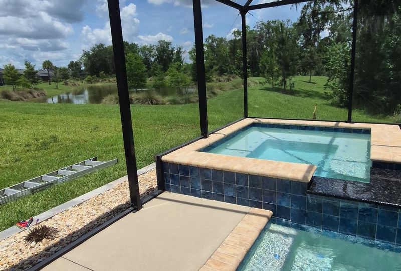 Interior view of screened pool and spa enclosure — Exact Aluminum Solutions Central Florida